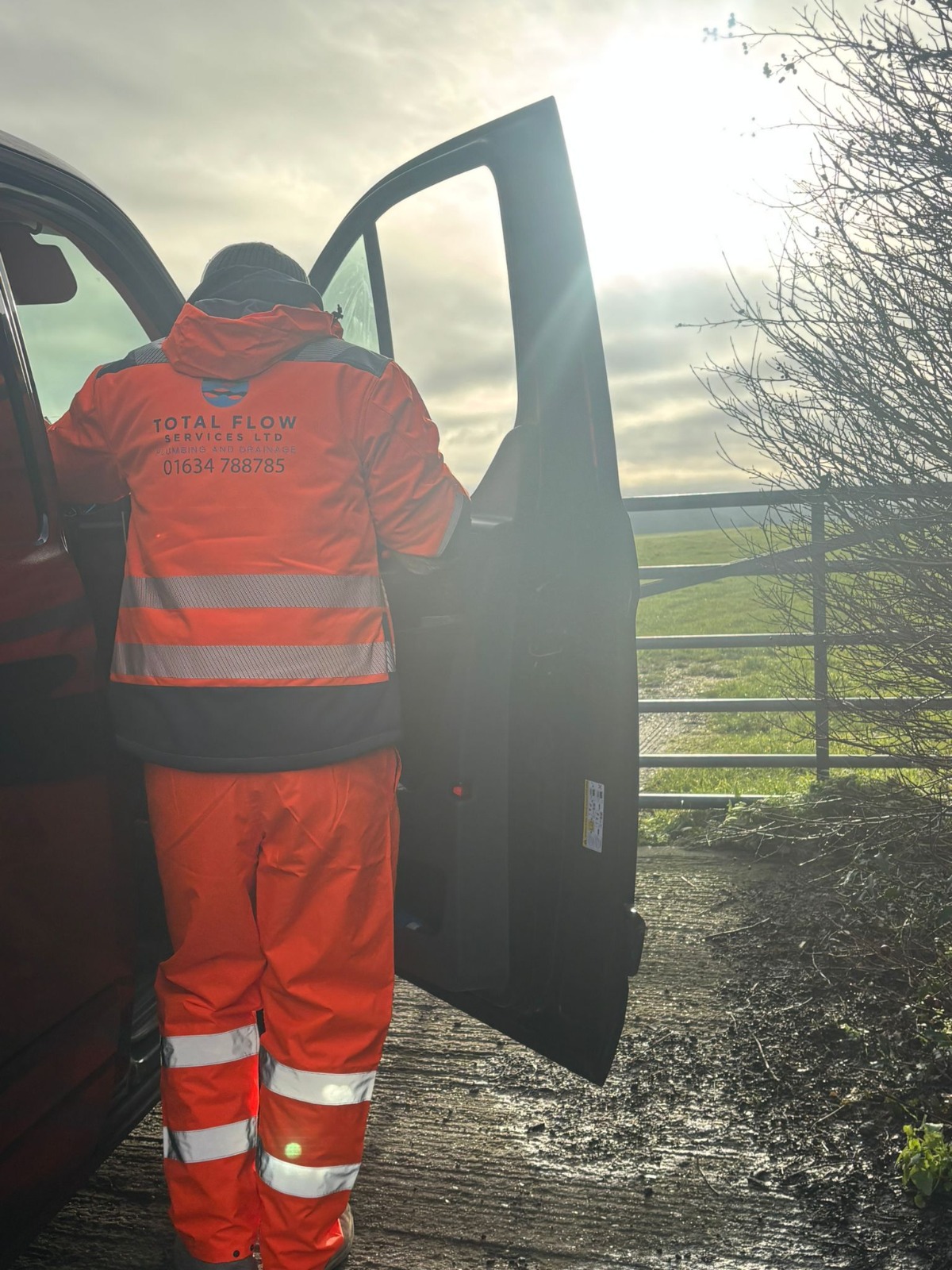 Total Flow Services engineer arriving on-site from the work van